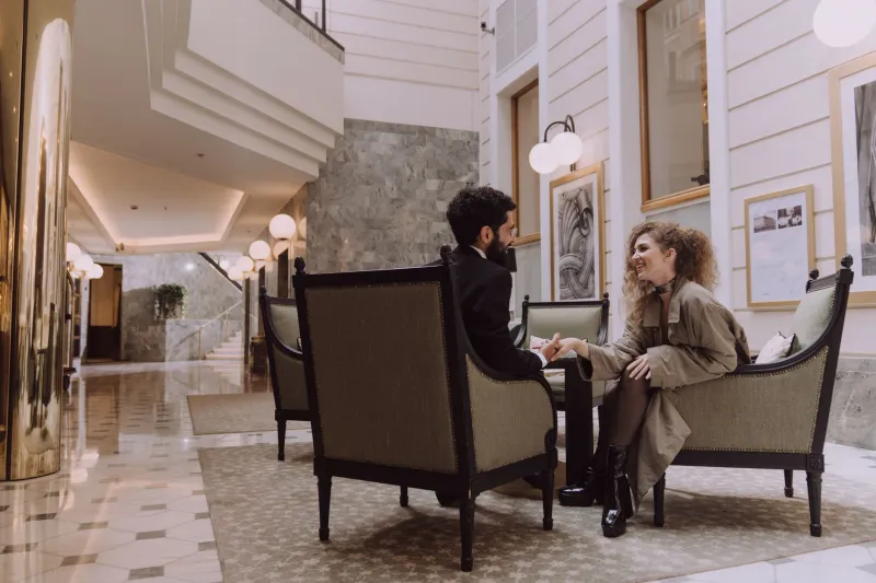 Checked In, Composed, and Invisible: The Modern Professional's Guide to Hotel Etiquette When Meeting a Companion